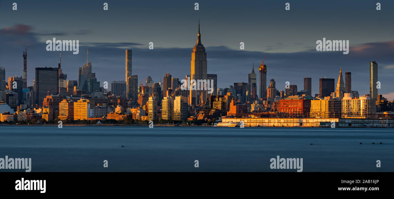 Panoramic sunset of Midtown Manhattan skyline and West Village from the Hudson River. New York City, NY, USA Stock Photo