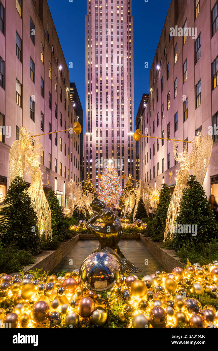 Christmas season decorations at Rockefeller Center Plaza with Christmas tree and holiday lights. Fifth Avenue, Midtown Manhattan, New York City, NY Stock Photo