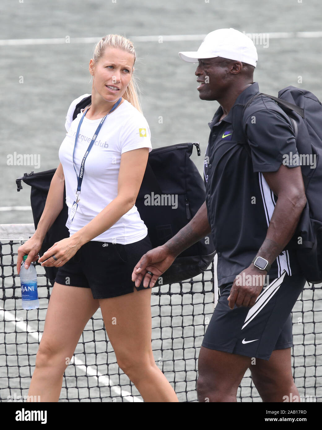 Delray Beach, Florida, USA. 24th November, 2019. Seal and his new slovenija  tennis pro girlfriend Tina Hojnik have a tender private moment on a side  court after they participated in the 30TH