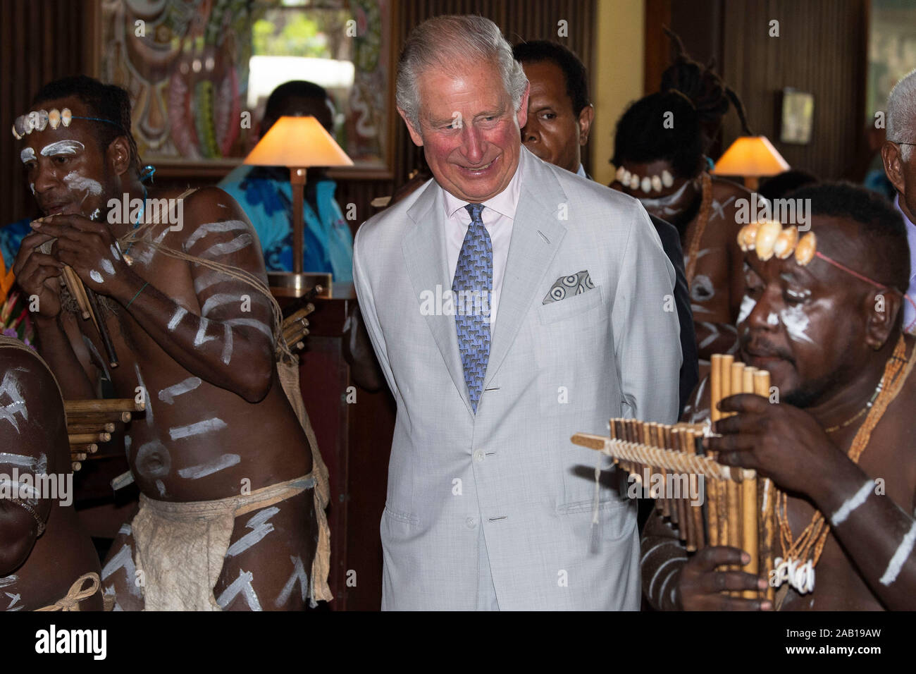 The Prince of Wales is greeted by a panpipes band as he arrives at a State Reception and lunch at the Mendana Hotel in Honiara, during day three of the royal visit to the Solomon Islands. PA Photo. Picture date: Monday November 25, 2019. See PA story ROYAL Charles. Photo credit should read: Chris Jackson/PA Wire Stock Photo