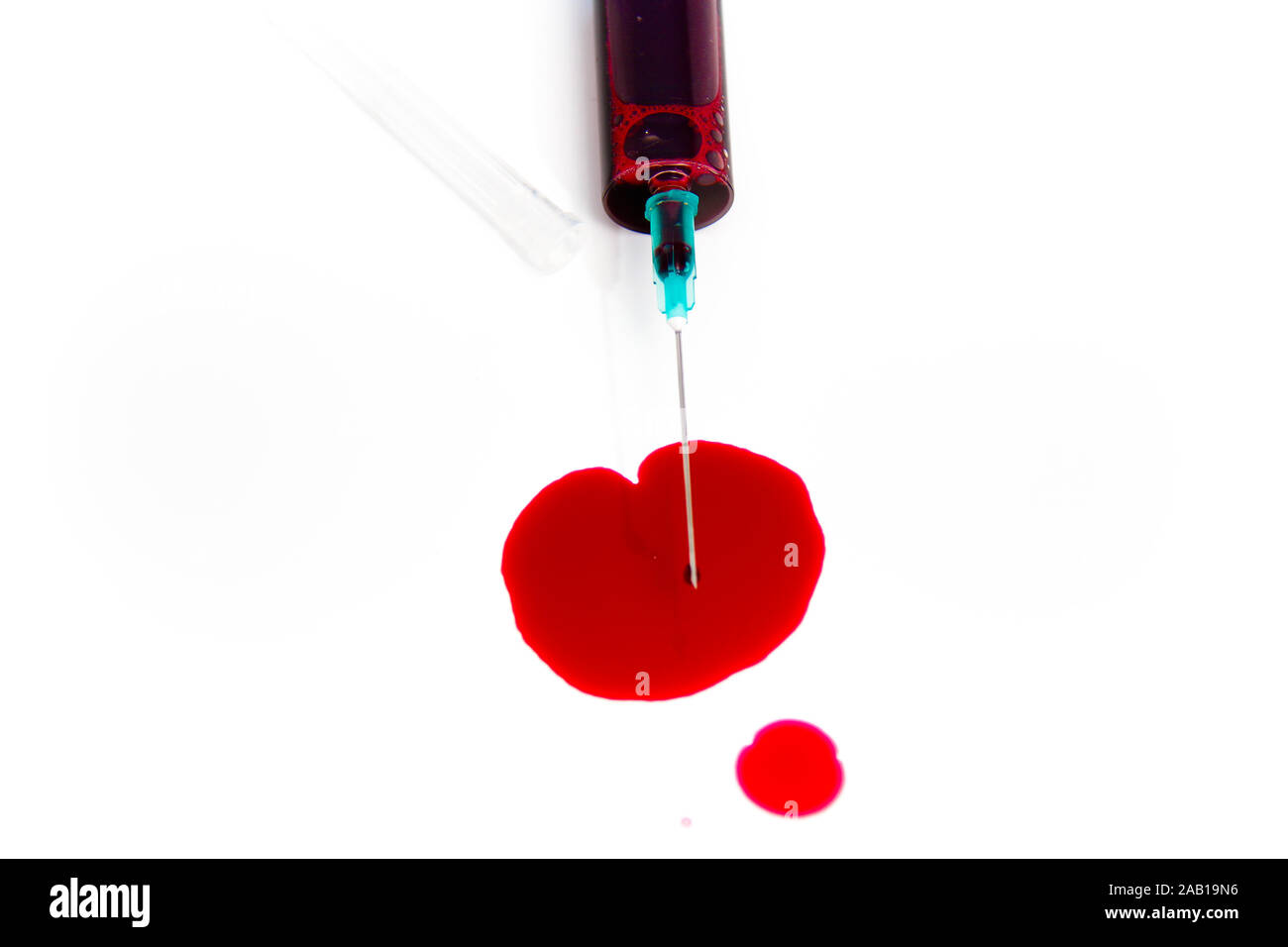 Photo of the Syringe in laboratory environment, blood and medical ...