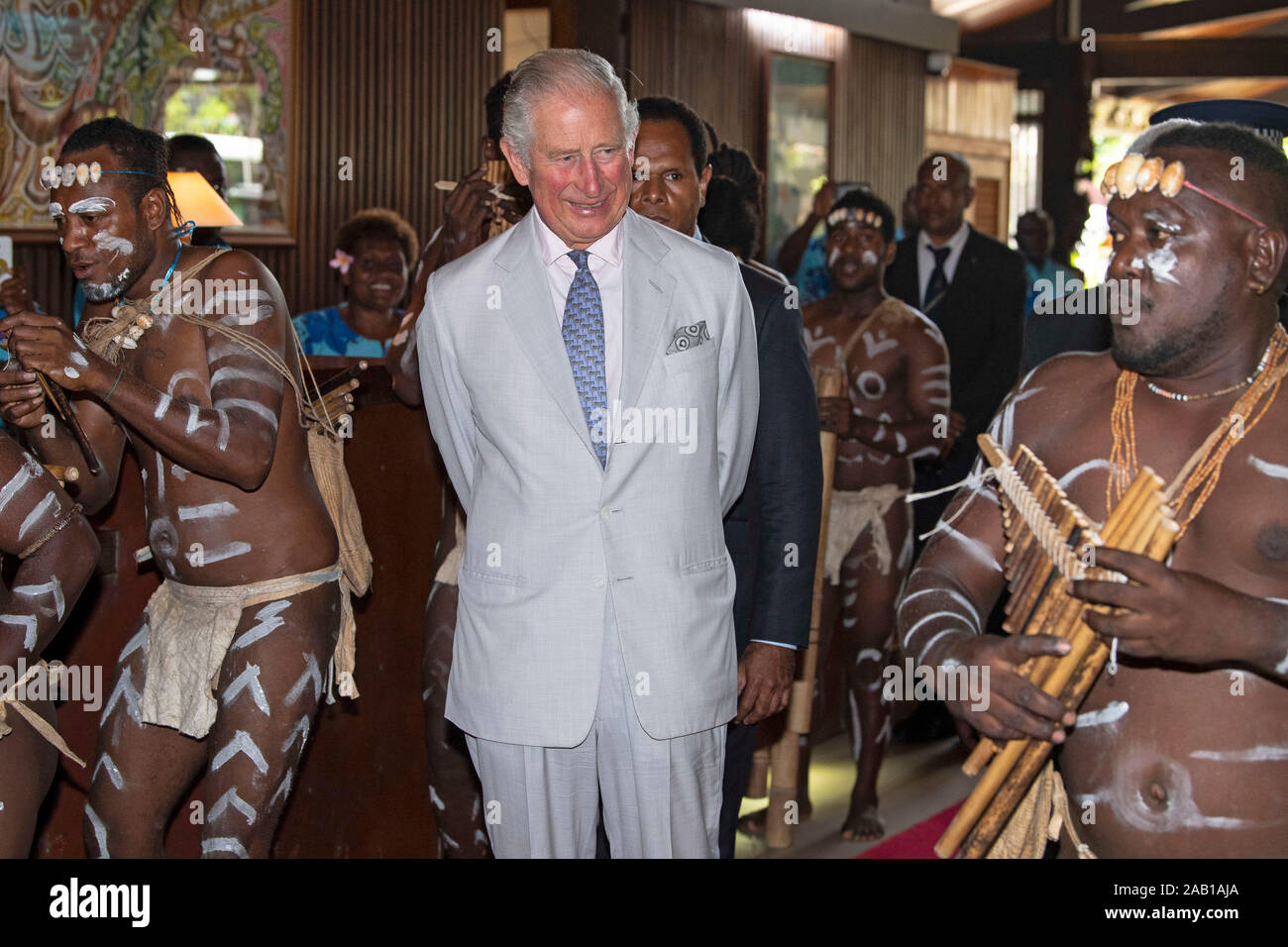 The Prince of Wales is greeted by a panpipes band as he arrives at a State Reception and lunch at the Mendana Hotel in Honiara, during day three of the royal visit to the Solomon Islands. PA Photo. Picture date: Monday November 25, 2019. See PA story ROYAL Charles. Photo credit should read: Victoria Jones/PA Wire Stock Photo