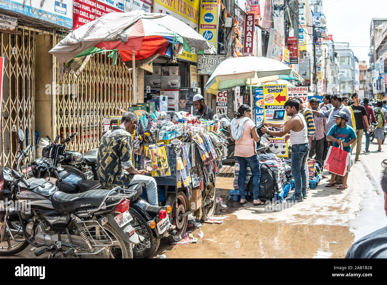 Bengaluru city, Sadar Patrappa Road, local electronic market with computers,  Hindus Indians doing shopping, narrow crowded street Stock Photo