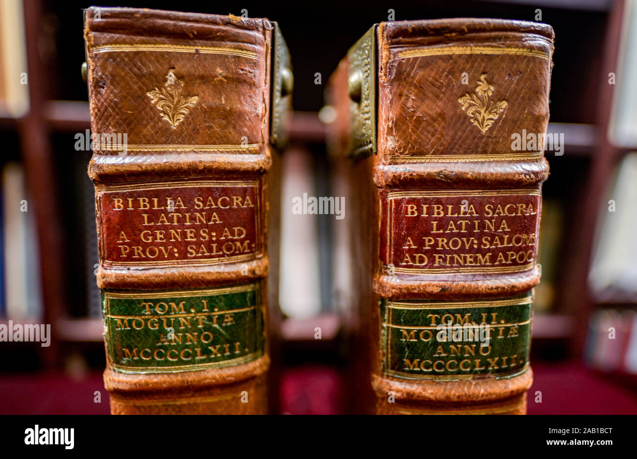 Hamburg, Germany. 19th Nov, 2019. The two volumes of a Bible from Gutenberg's printing press, which are auctioned off in an anniversary auction of valuable books, are on red velvet at Ketterer Kunst, a Hamburg art auction house. The Biblia latina from 1462 by Johannes Fust and Peter Schöffer, the direct successors of Johannes Gutenberg, is worth one million euros and has a circulation of 75 copies. Credit: Axel Heimken/dpa/Alamy Live News Stock Photo