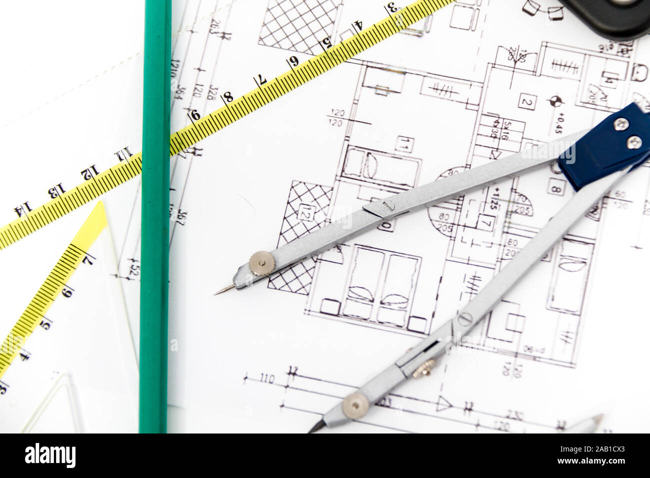 Photo of the Architectural project, pair of compasses, rulers and ...