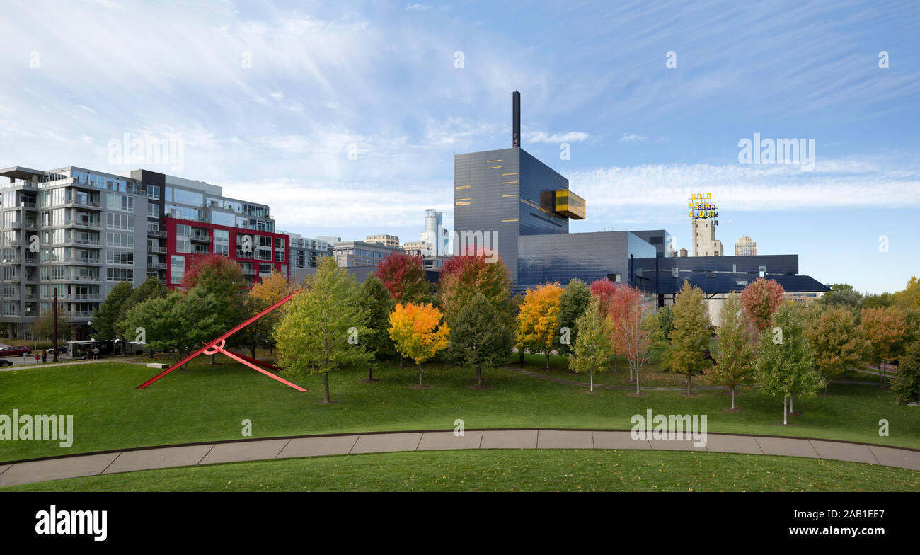 Gold Medal Park and the Guthrie Theater during the fall season in downtown Minneapolis, Minnesota.  The 1977-1983 red metal painted sculpture Molecule Stock Photo