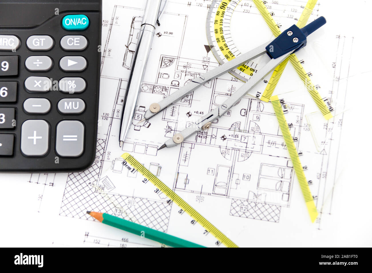 Photo of the Architectural project, pair of compasses, rulers and ...