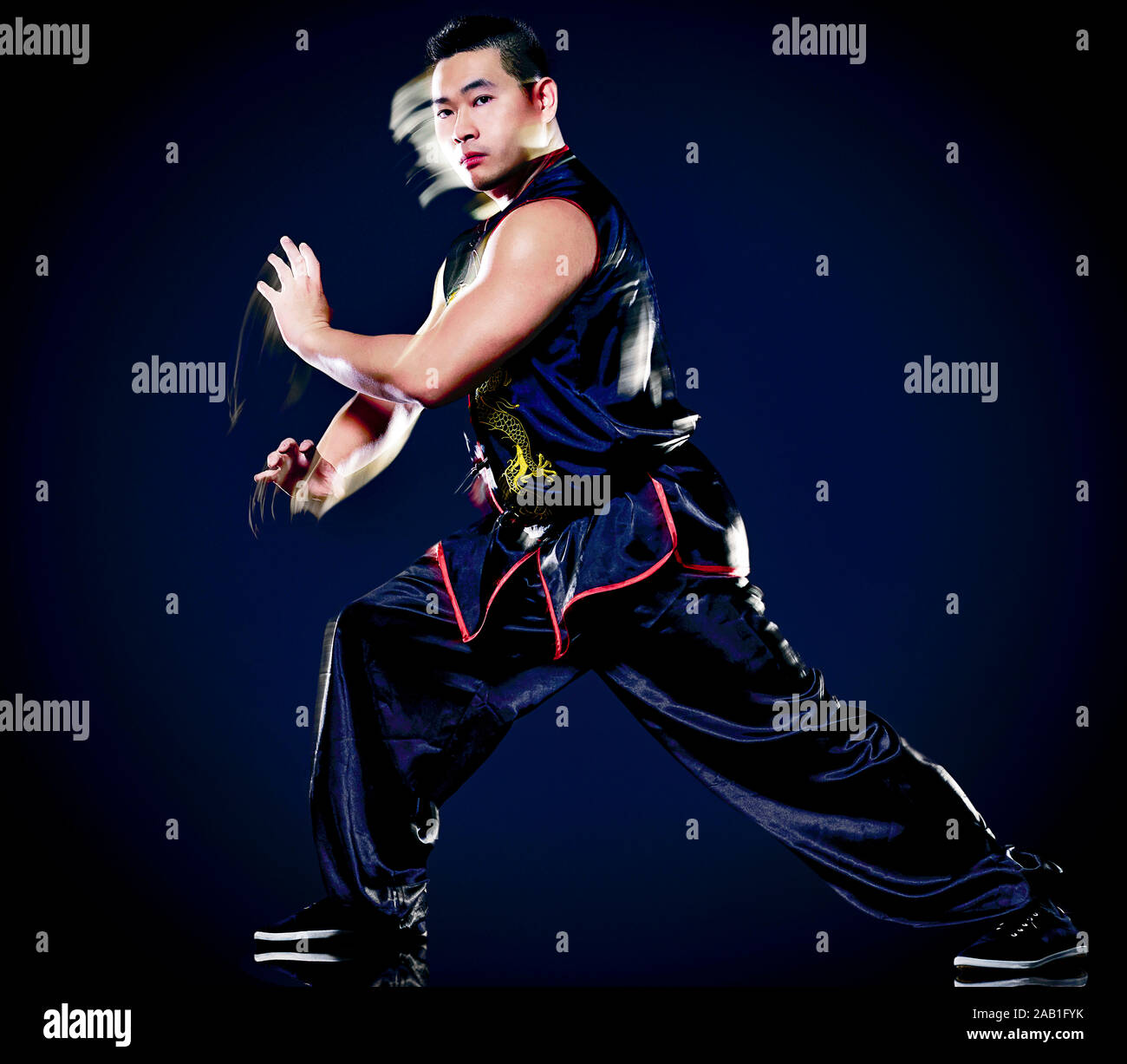 wushu chinese boxing kung fu Hung Gar fighter isolated man isolated on  black background with speed light painting effect motion blur Stock Photo -  Alamy