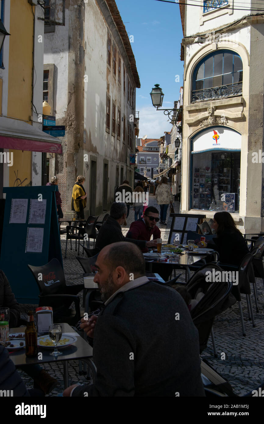 Street scene with people in a cafe in central Aveiro Portugal Stock Photo