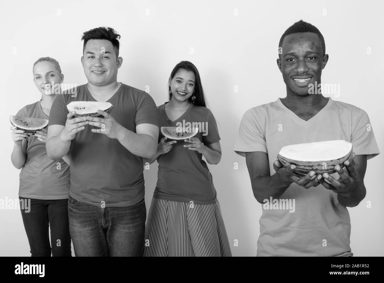 Four diverse young friends smiling Black and White Stock Photos ...