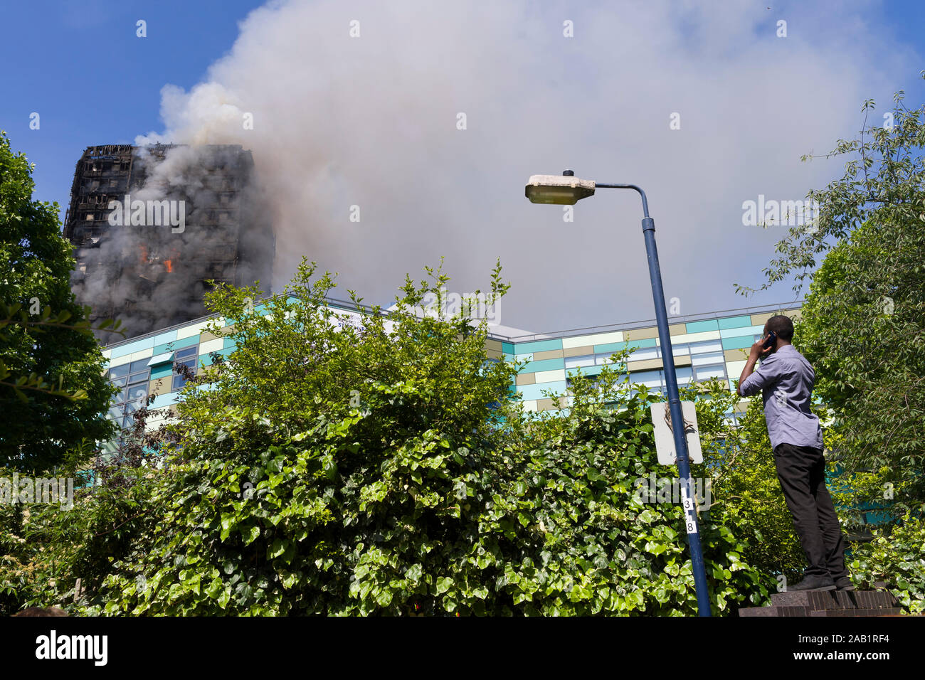 Onlooker watching the Grenfell Tower fire. Grenfell Tower was a 24storey block of flats part of