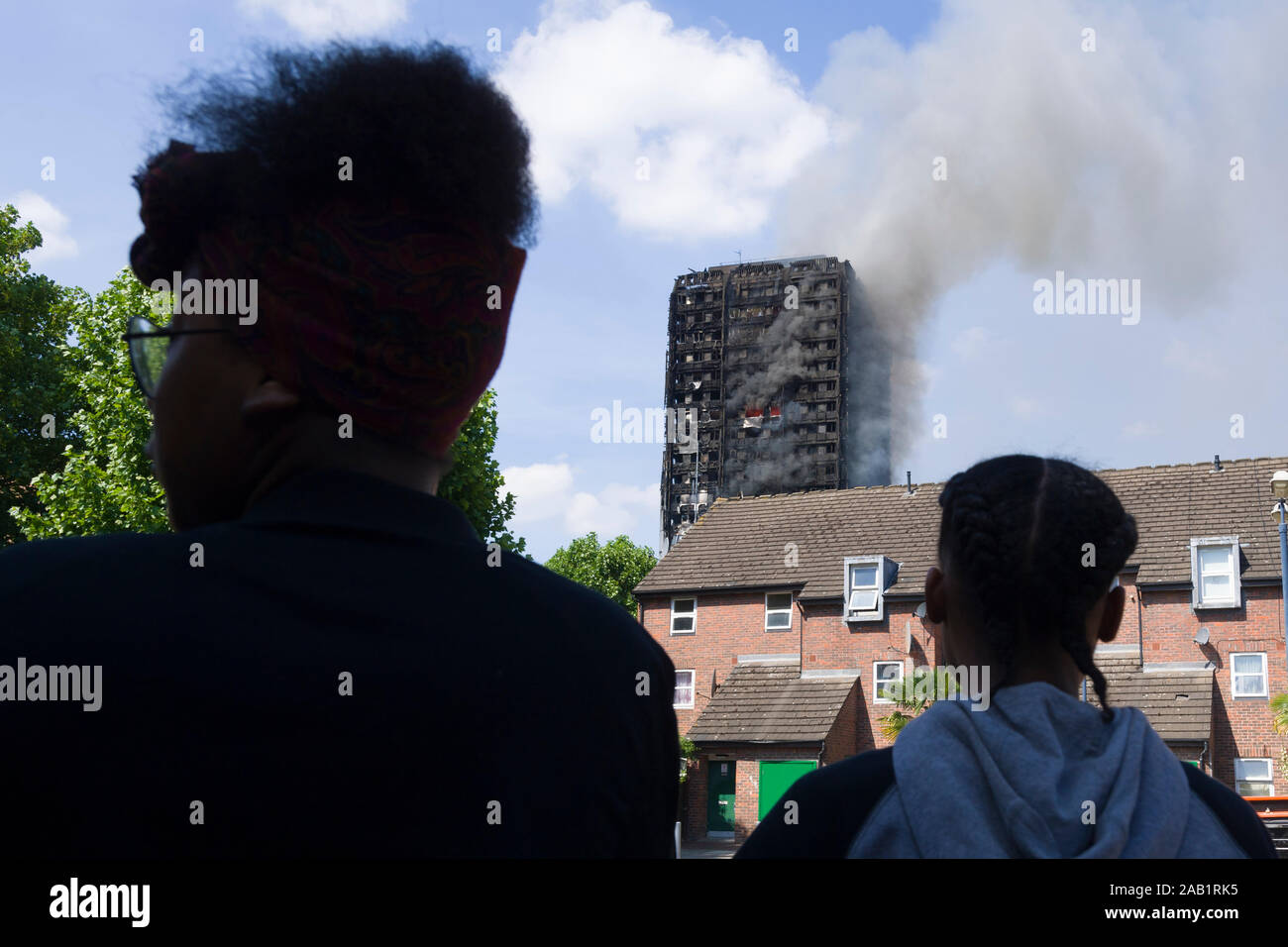 Onlookers watching the Grenfell Tower fire. Grenfell Tower was a 24storey block of flats part