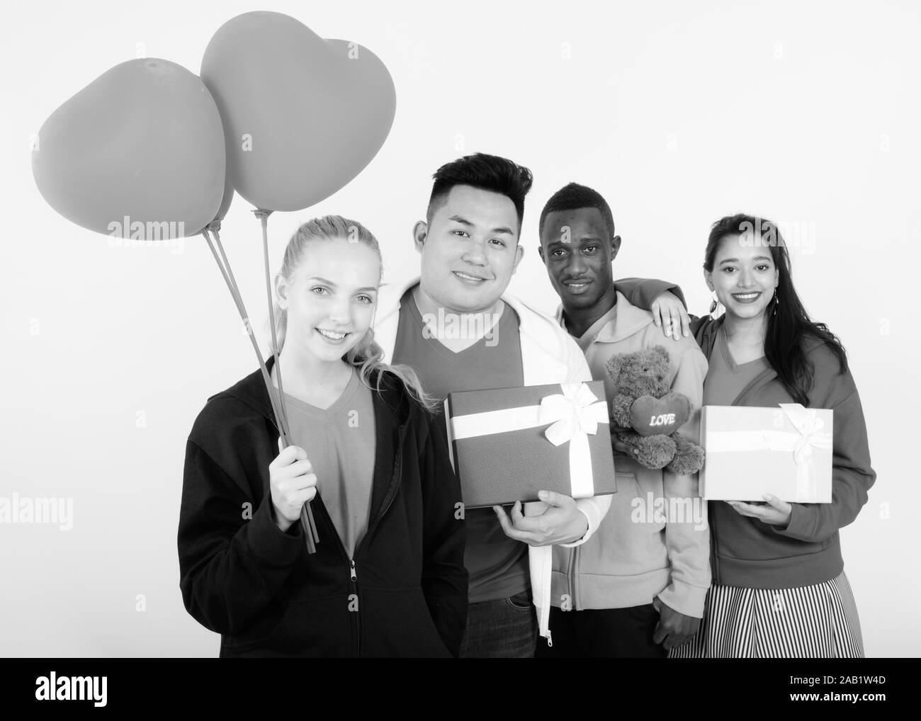 Four diverse young friends smiling Black and White Stock Photos ...
