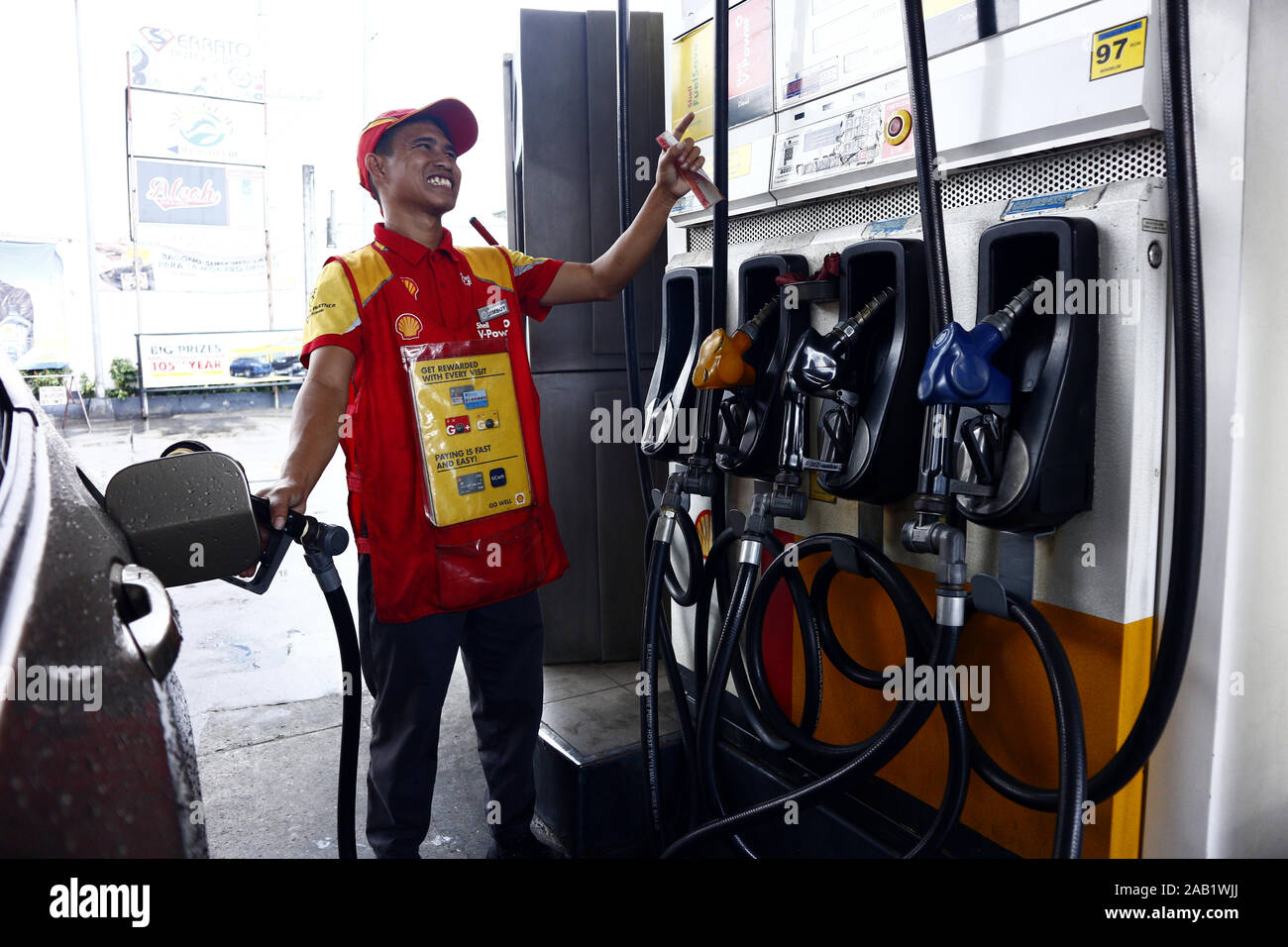 Cainta, Rizal, Philippines November 23, 2019 Employee at a gasoline