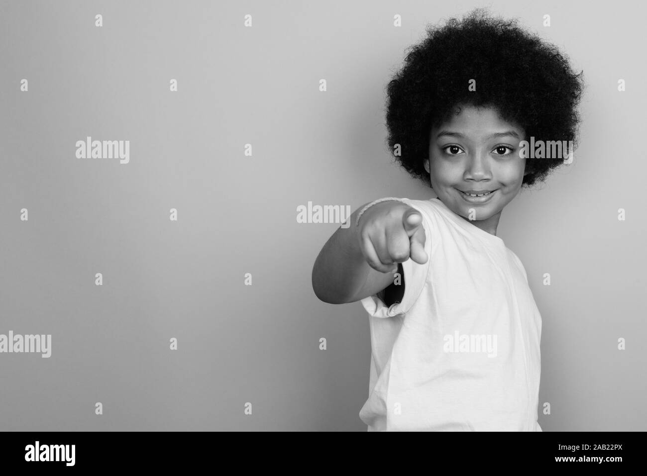 Young Cute African Girl With Afro Hair In Black And White Stock