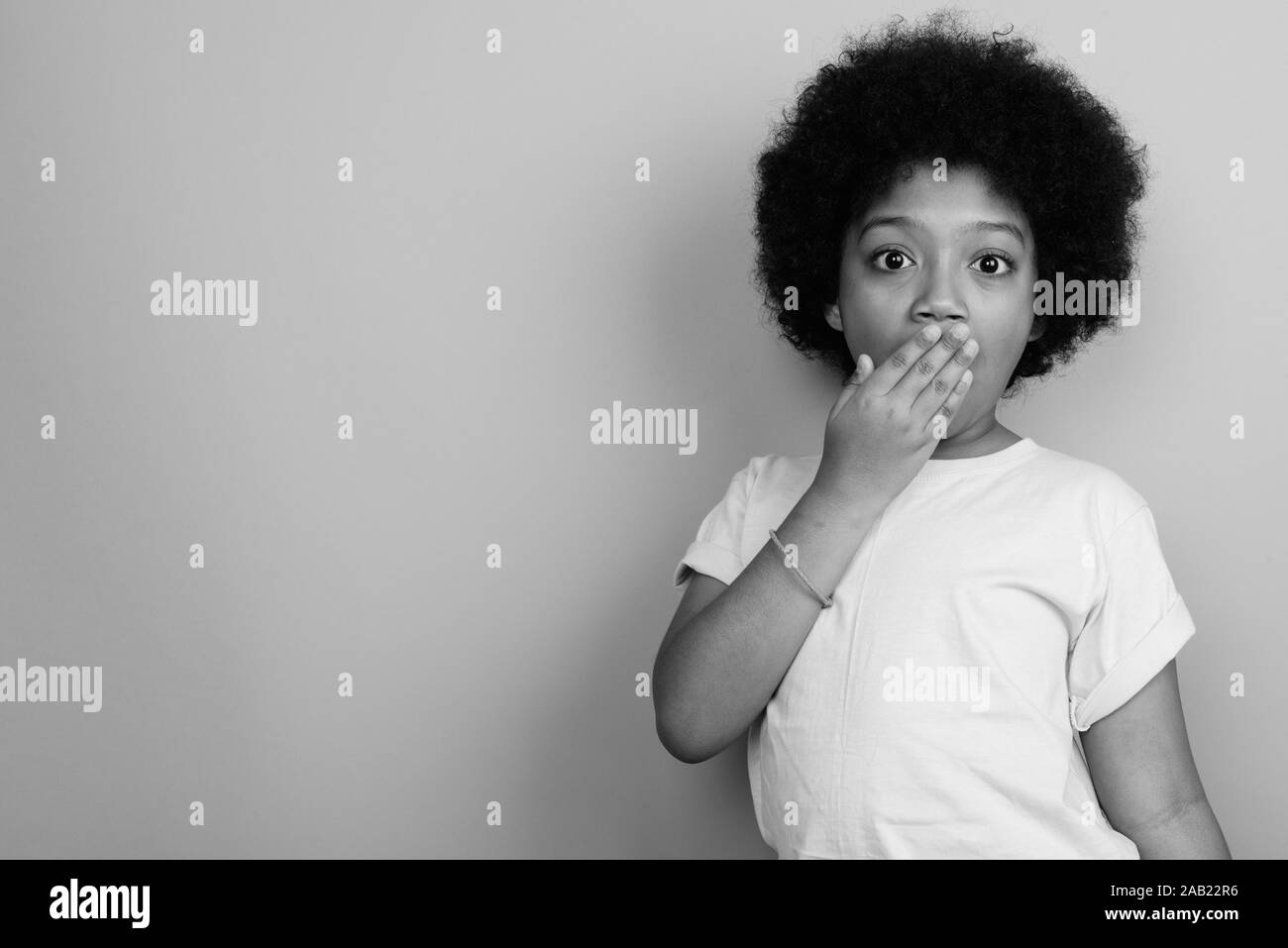 Young Cute African Girl With Afro Hair In Black And White Stock