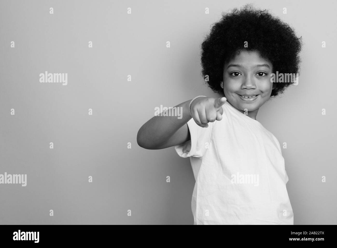Young Cute African Girl With Afro Hair In Black And White Stock