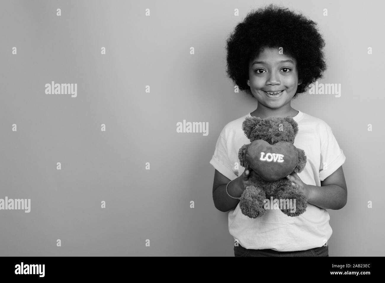 Young Cute African Girl With Afro Hair In Black And White Stock
