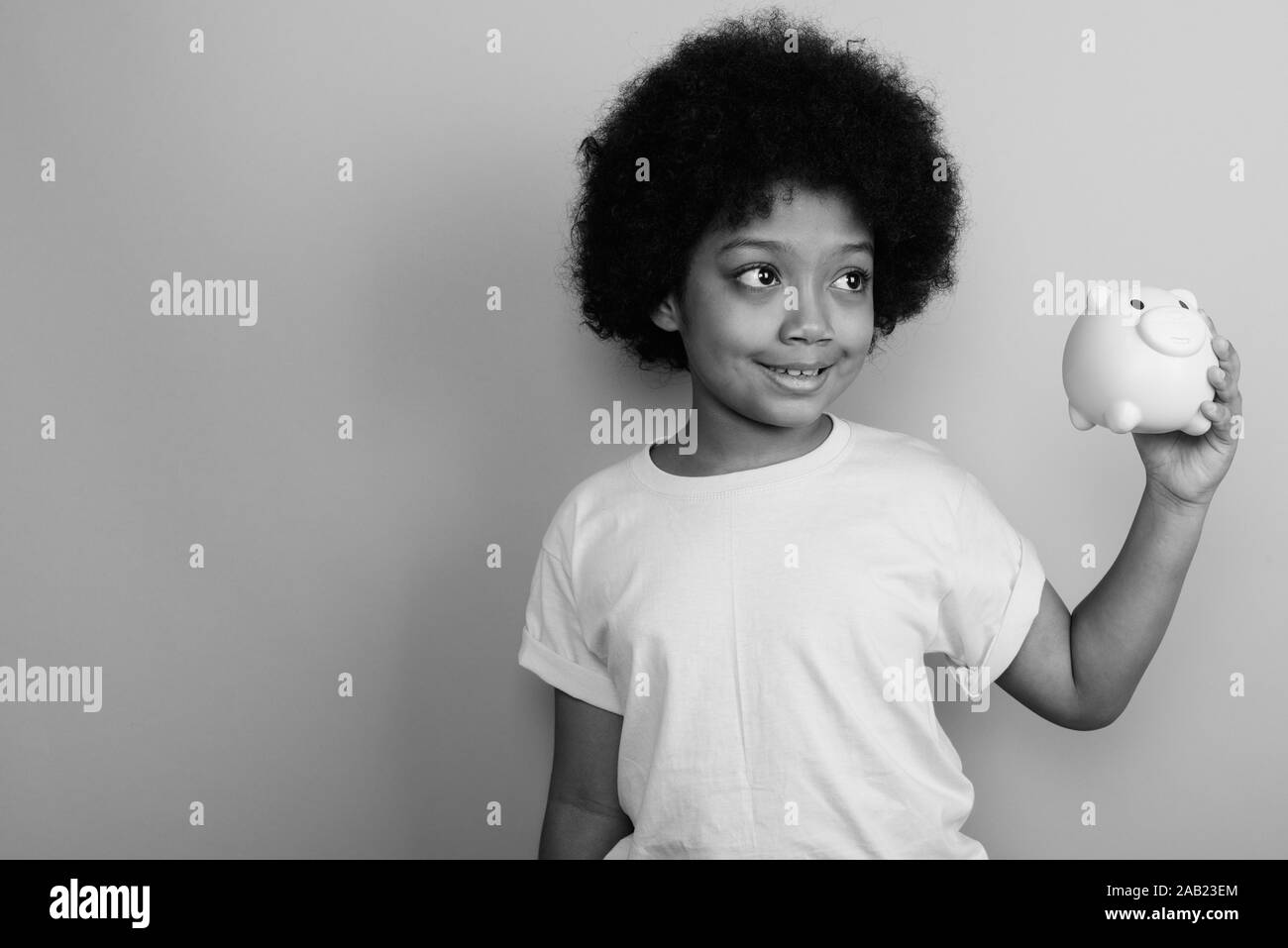 Young Cute African Girl With Afro Hair In Black And White Stock