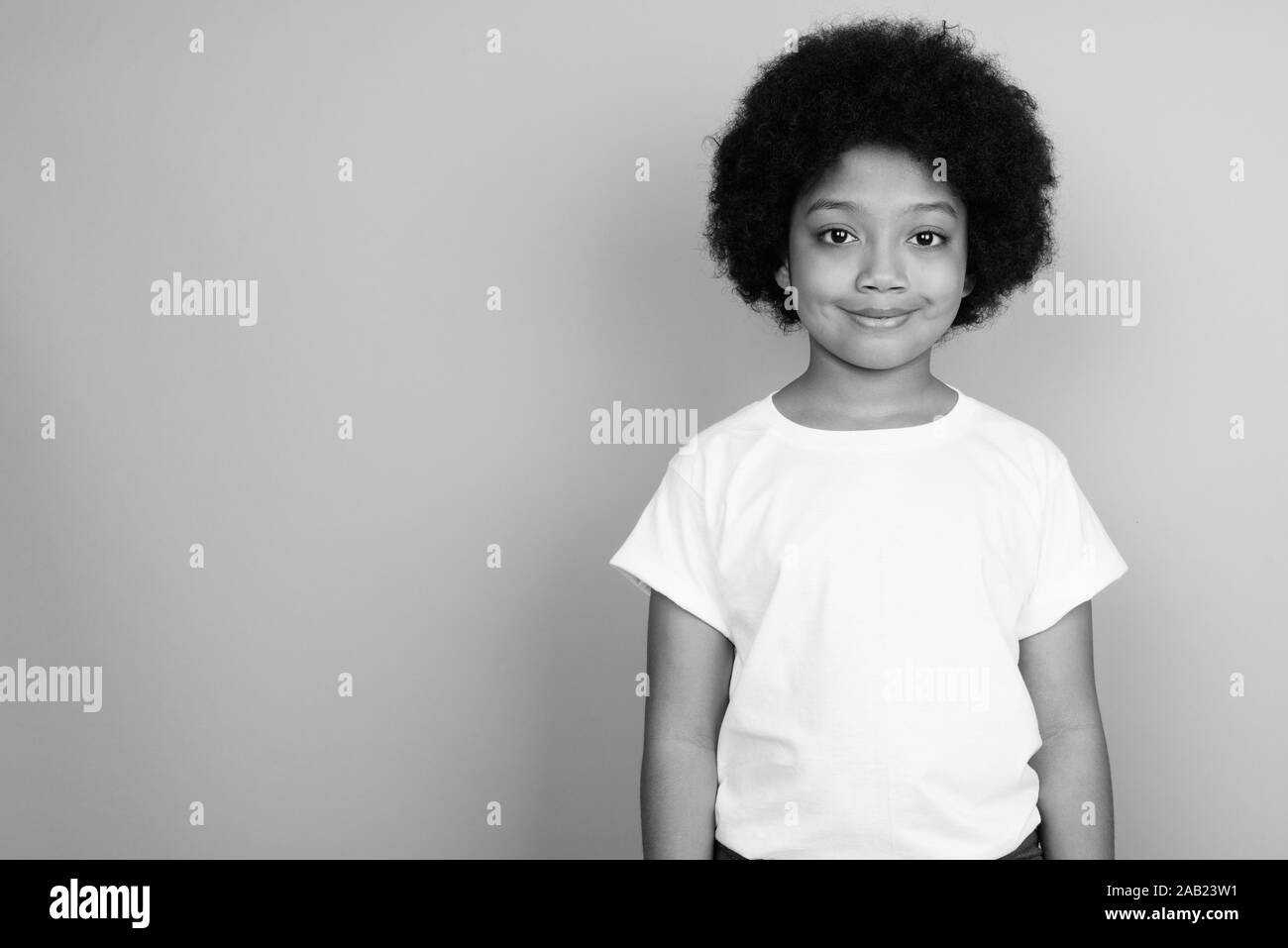 Young Cute African Girl With Afro Hair In Black And White Stock