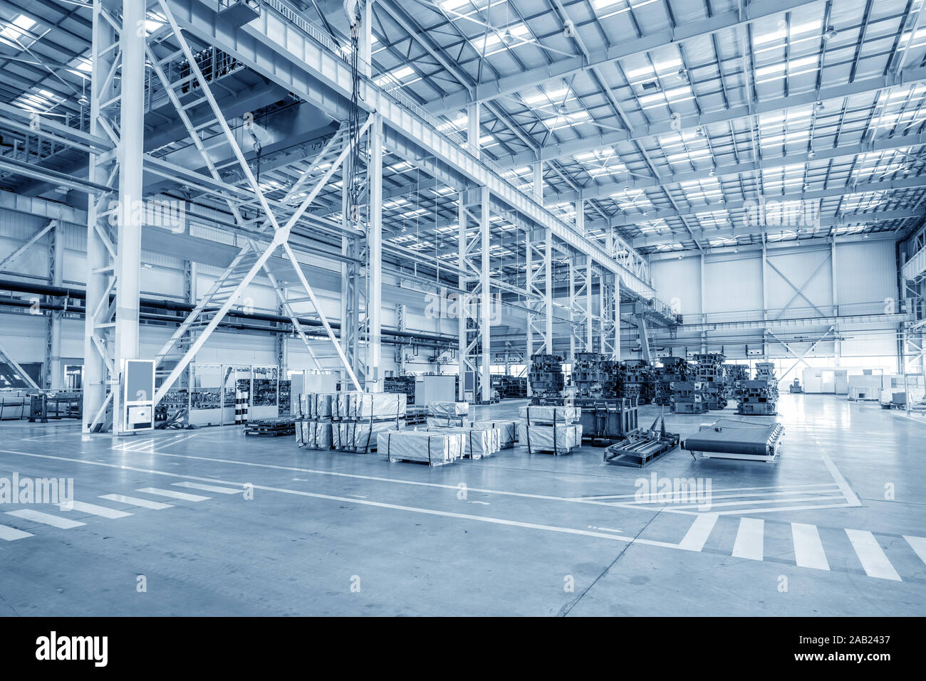 The interior of a big industrial building or factory with steel constructions Stock Photo