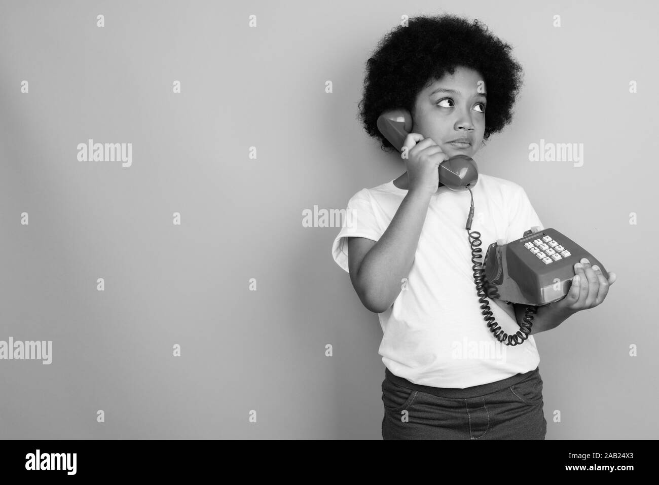 Young Cute African Girl With Afro Hair In Black And White Stock