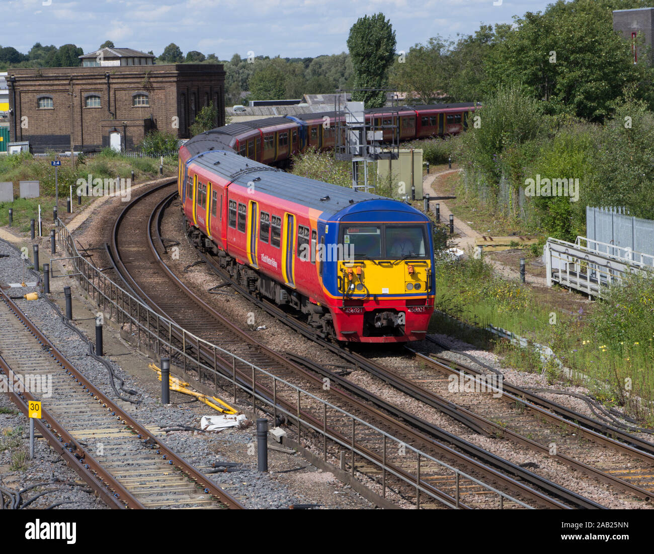 South Western Raailway Class 456 electric train approches Guildford ,Surrey station on 13.08.19. Stock Photo