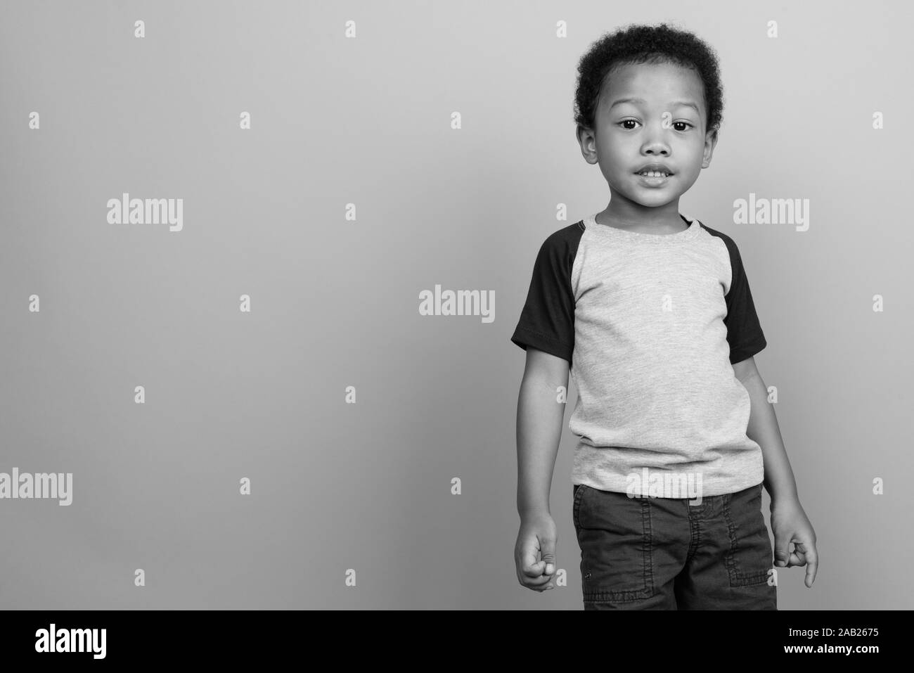 Young Cute African Boy With Afro Hair In Black And White Stock
