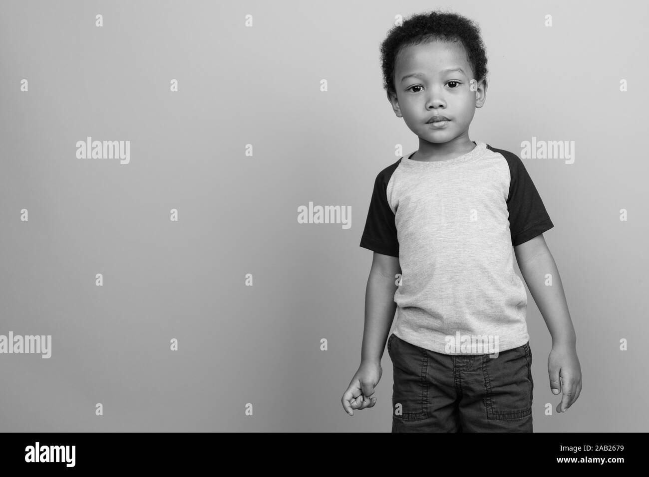 Young cute African boy with Afro hair in black and white Stock Photo ...