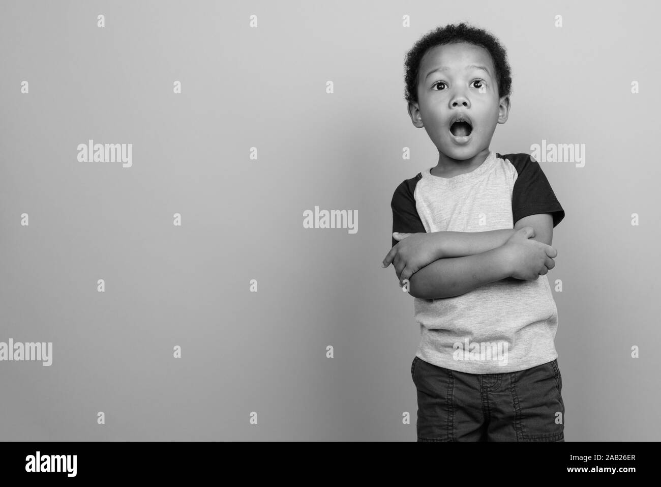 Young cute African boy with Afro hair in black and white Stock Photo ...