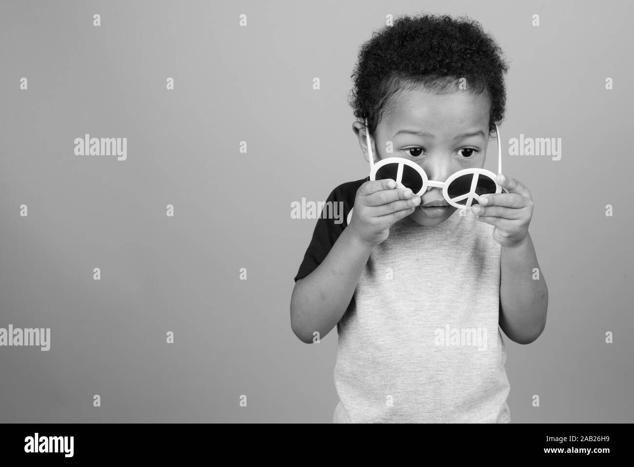 Young cute African boy with Afro hair in black and white Stock Photo