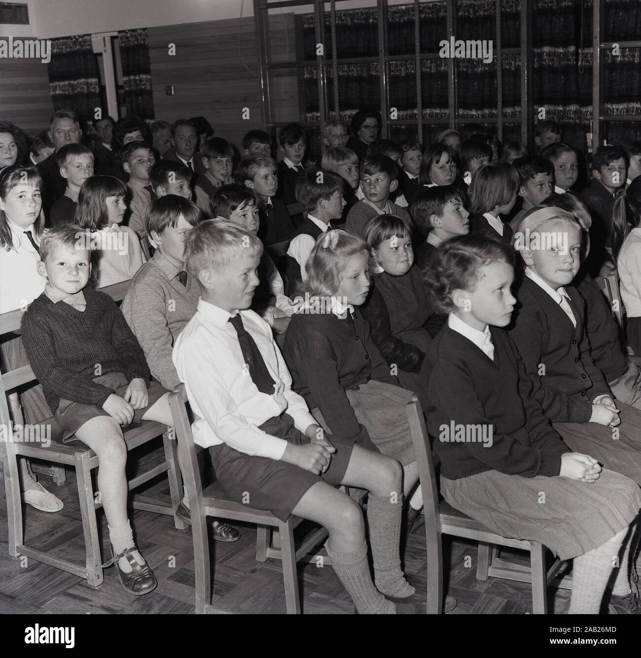 1964, historical, primary school children and teachers sitting in the