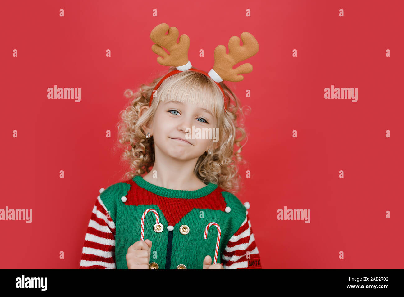 Merry Christmas Little Girl In Santa Elf Helper Costume On