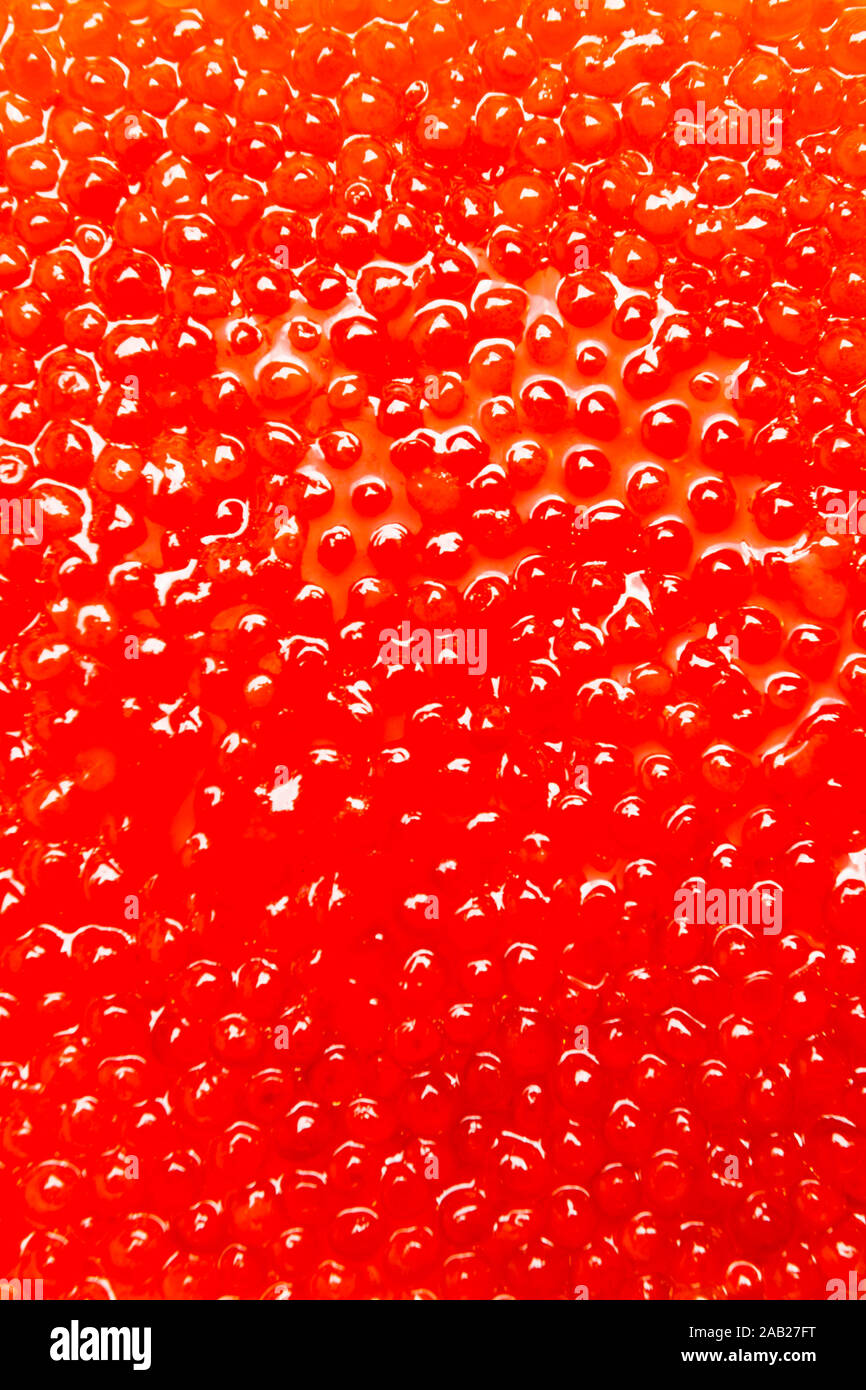 Red salmon caviar close-up, a lot of small eggs Stock Photo