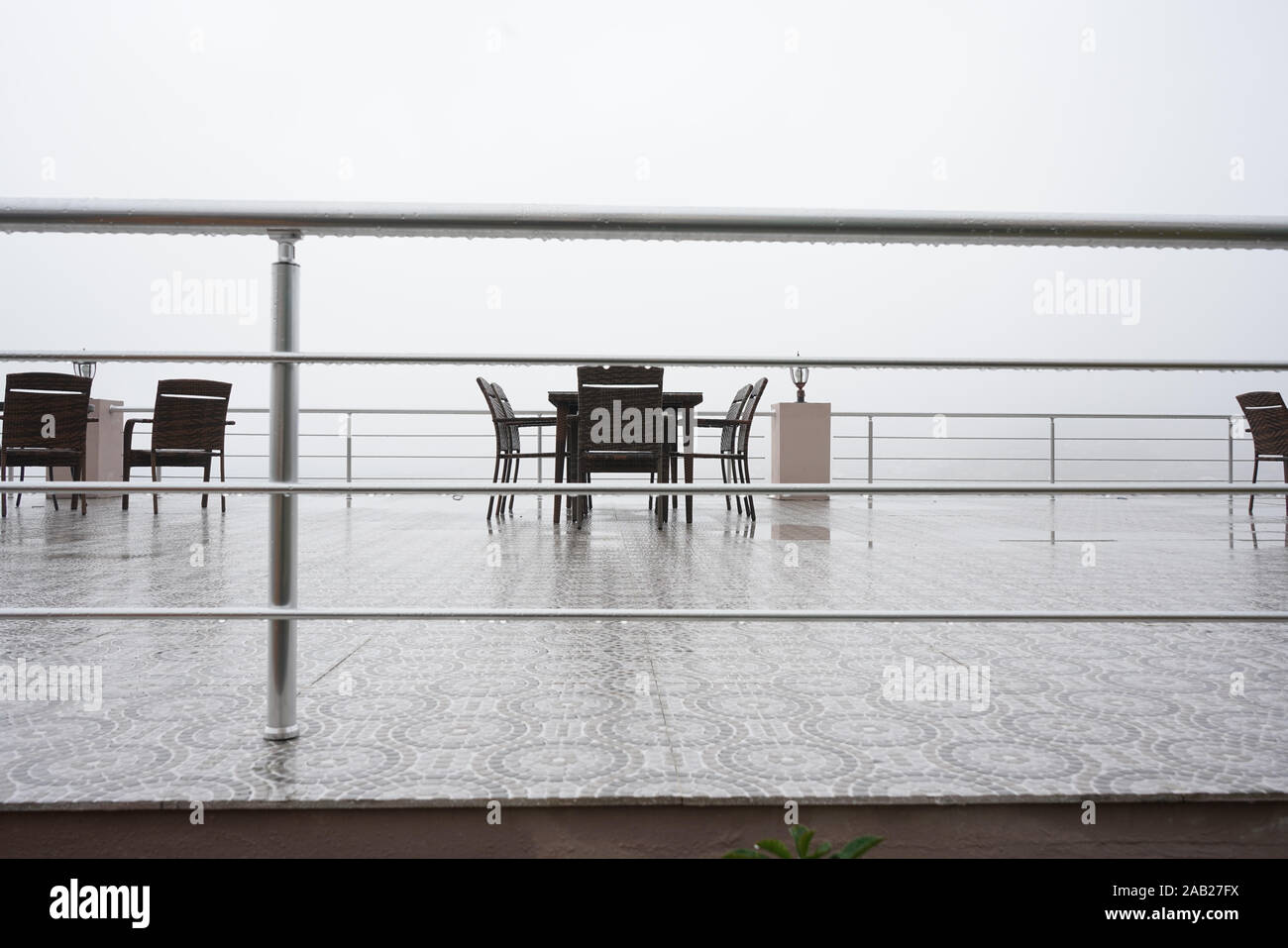 Empty Local Coffee Shop or outdoor restaurant on the mountain with foggy weather. Stock Photo