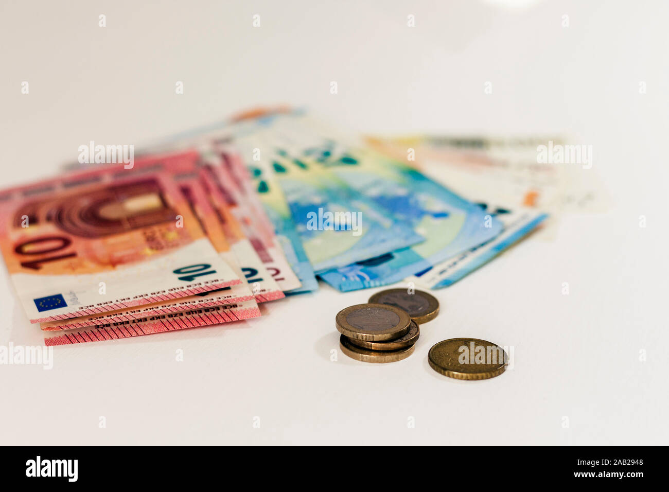 Close up money euro banknotes and coins on white background Stock Photo ...