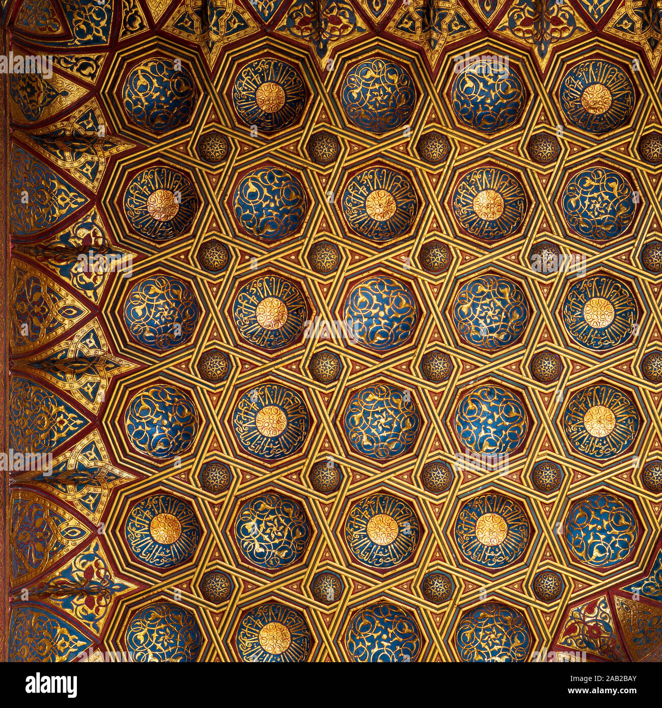 Golden floral pattern decorations, part of ceiling of Mausoleum of Sultan Qalawun, Sultan Qalawun Complex, located in Muizz Street, Gamalia district, Cairo, Egypt Stock Photo