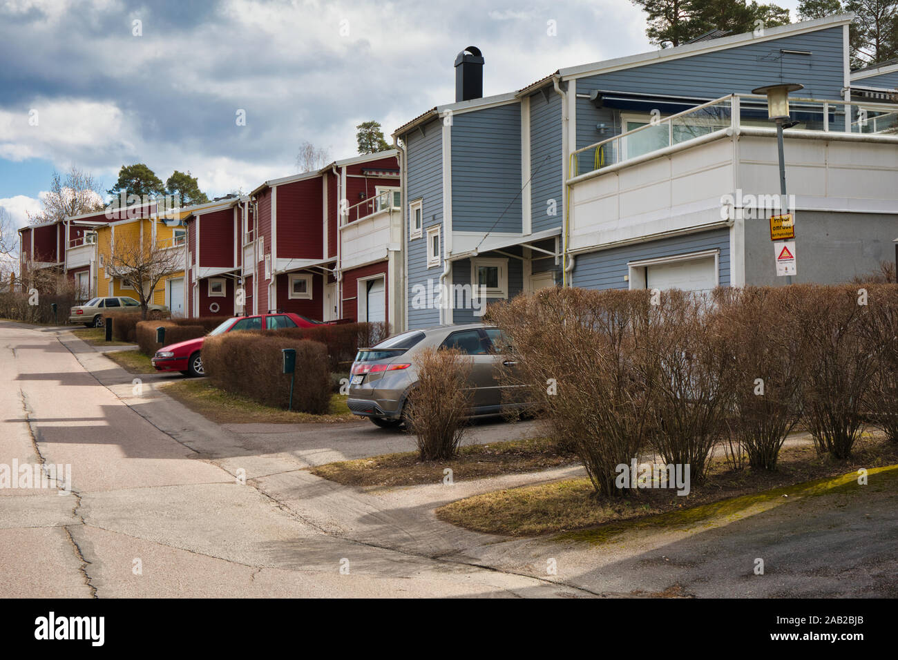 Street of typical suburban Swedish houses in the Stockholm suburb of Upplands Vasby, Stockholm, Sweden Stock Photo
