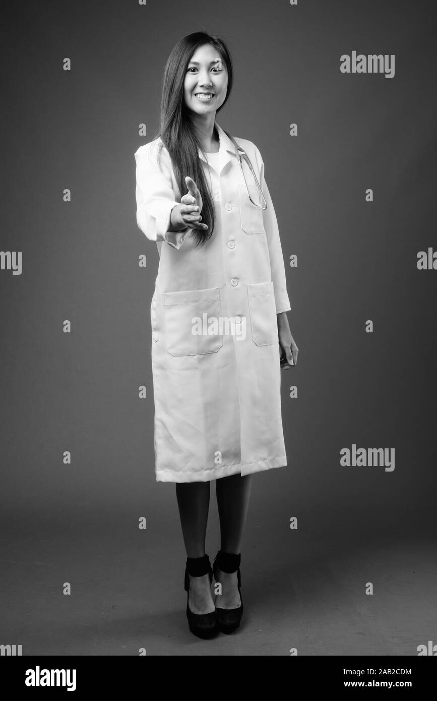 Young beautiful Asian woman doctor in black and white Stock Photo - Alamy