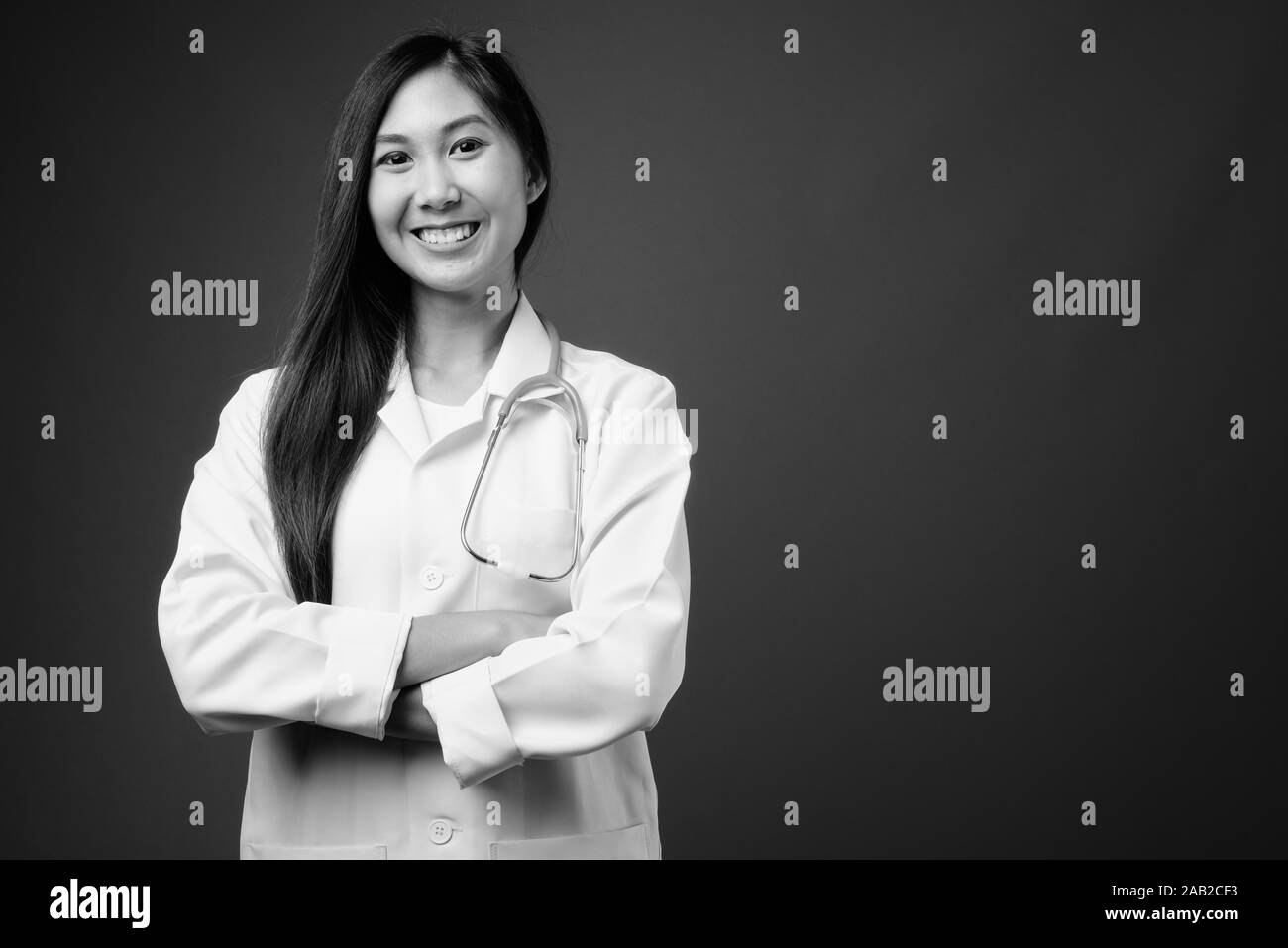 Young beautiful Asian woman doctor in black and white Stock Photo - Alamy