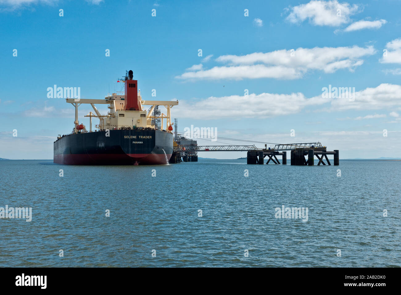 Oil tanker being loaded with oil at the Hound Point Tanker Terminal. Located in the Inner Firth of Forth near the Forth Raliway Bridge. Scotland Stock Photo