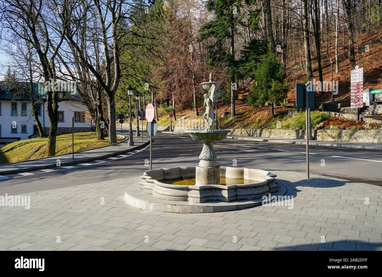 Beautiful sculpted water fountain with statue and art elements in in Sinaia City , Romania Stock Photo