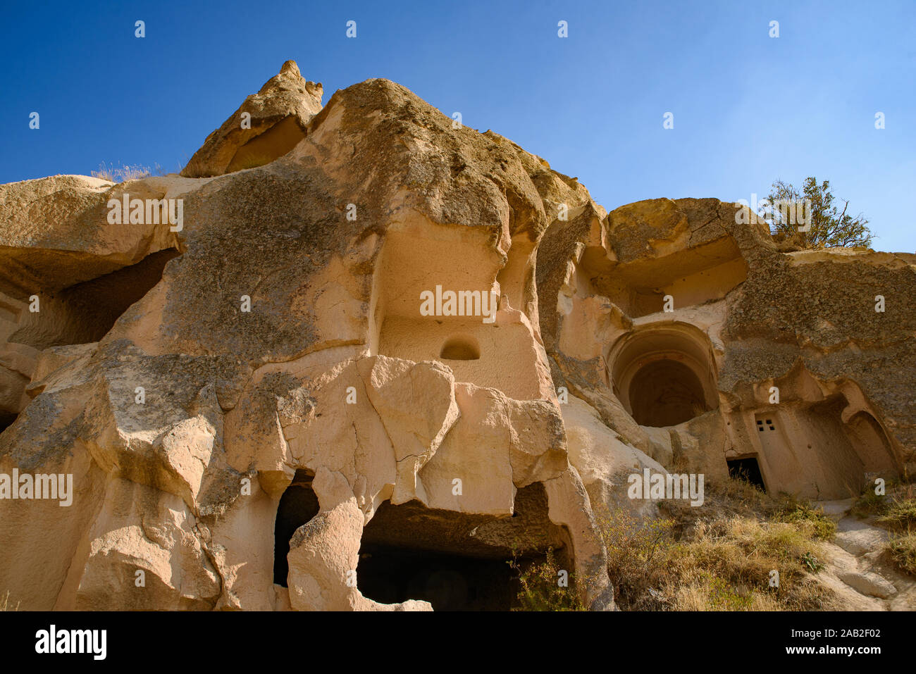 Cave houses carved in stone at Göreme, Cappadocia, Turkey Stock Photo