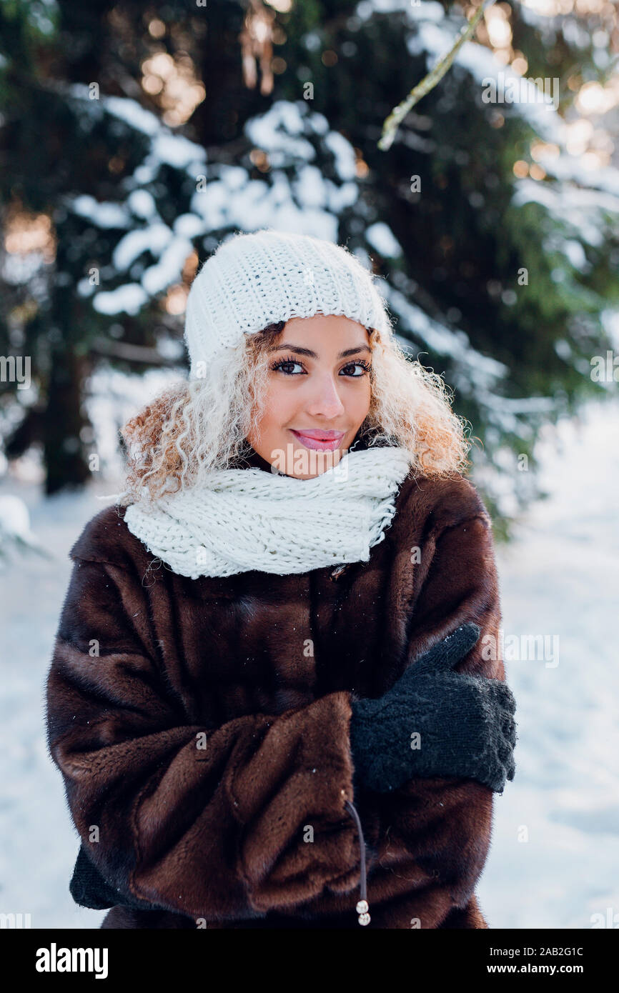 afro american girl wearing in fur coat 