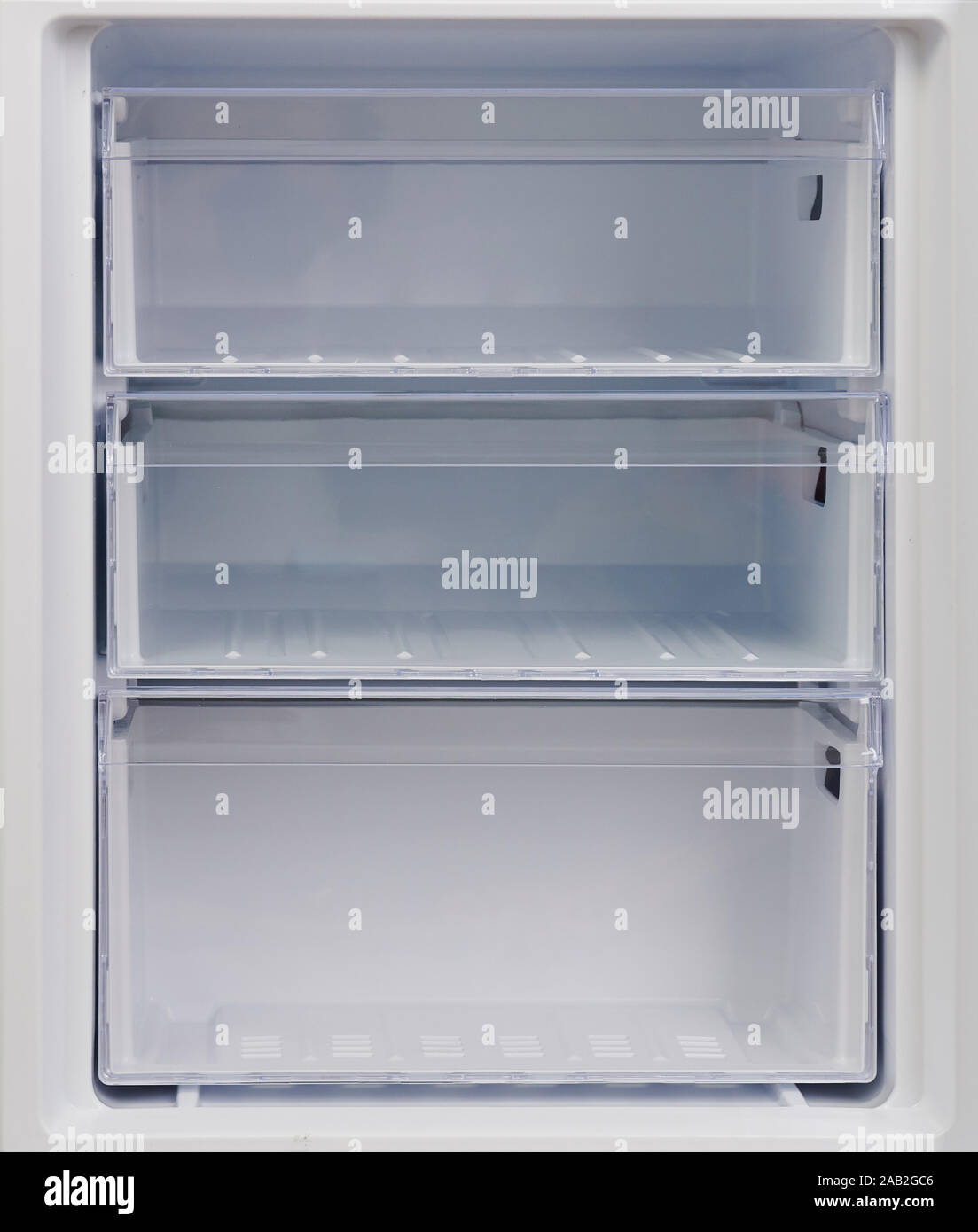 Refrigerator freezer compartment. Clean empty plastic rack Stock Photo
