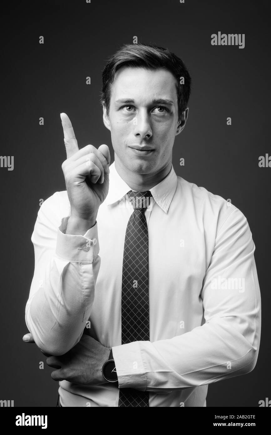Young handsome businessman in black and white Stock Photo - Alamy
