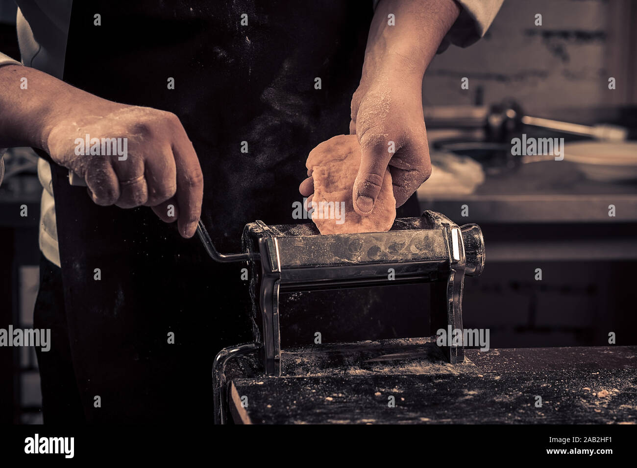The chef makes fresh spaghetti from scratch. Stock Photo
