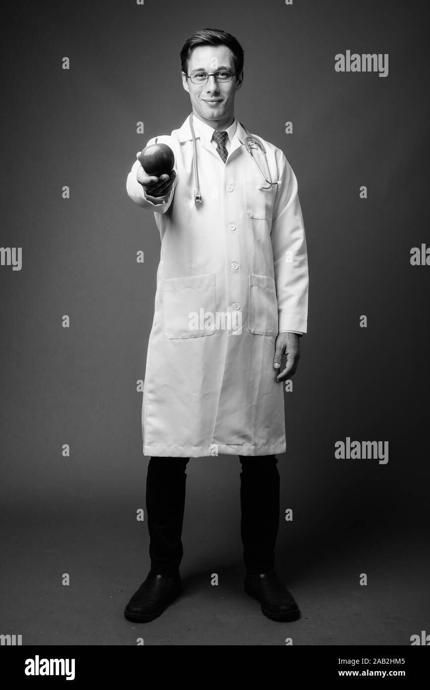 Doctor on white background full body Black and White Stock Photos ...