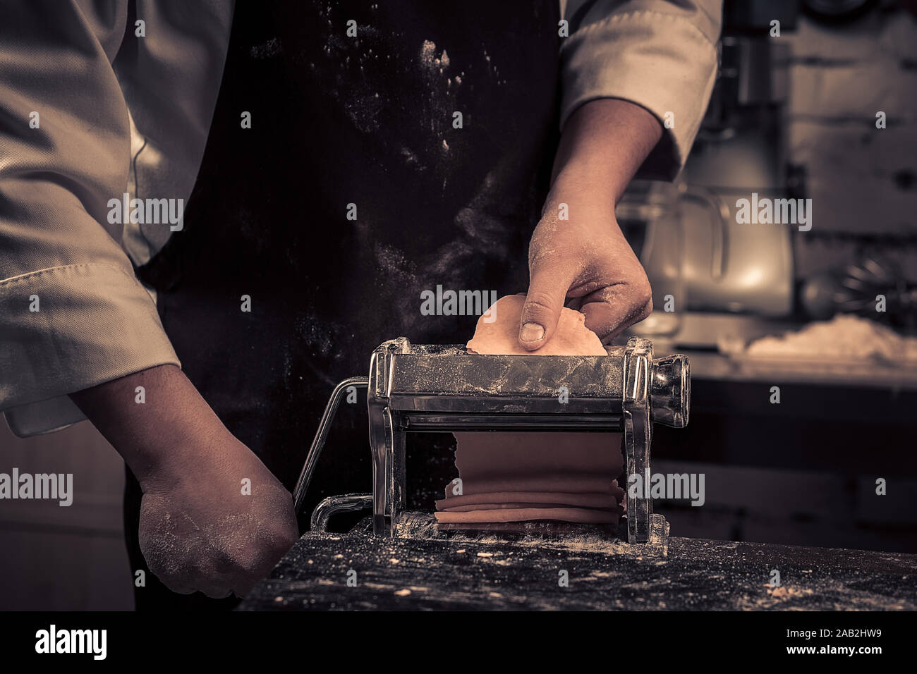 The chef makes fresh spaghetti from scratch. Stock Photo