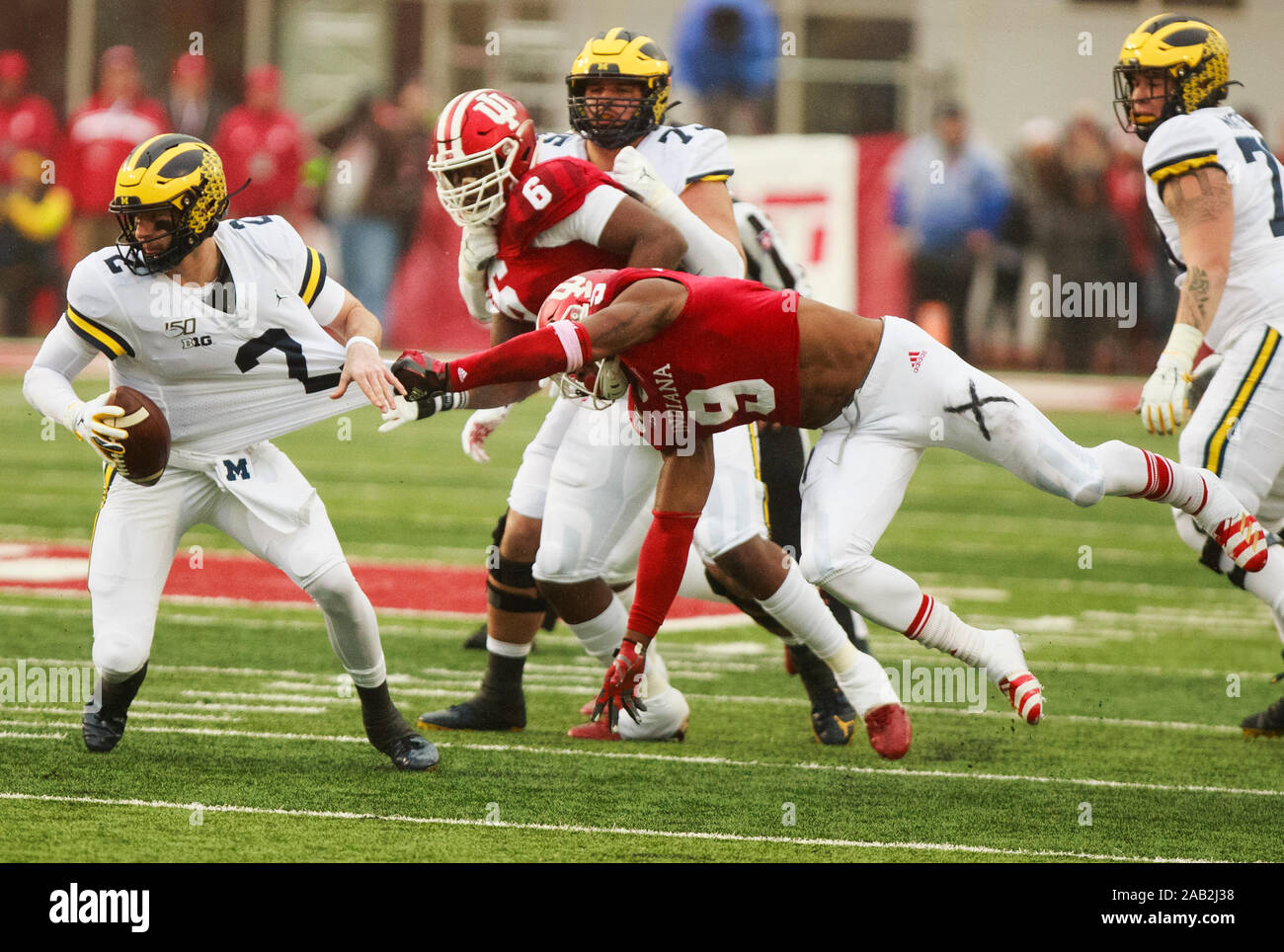 U's Marcelino Ball (9) stops Michigan's Shea Patterson (2) during an NCAA college football game at the Memorial Stadium in Bloomington.(Final score; Indiana University 14:39 Michigan University) Stock Photo
